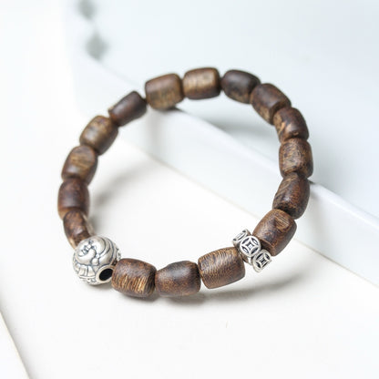 Full view of the Agarwood Silver Strength Calm Bracelet, showcasing the complete design