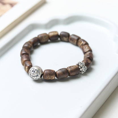  Another full view of the Agarwood Silver Strength Calm Bracelet highlighting the natural beauty