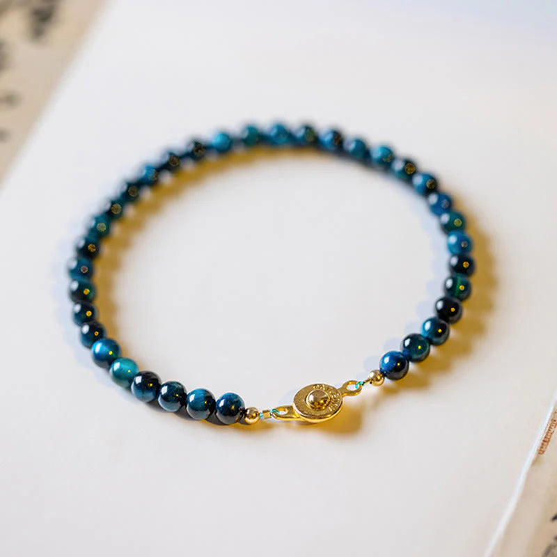 Natural Blue Tiger Eye Stone Protection Bracelet displayed with background, emphasizing its charm and protection