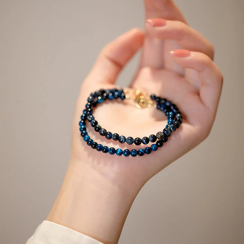 Close-up of the Natural Blue Tiger Eye Stone Protection Bracelet on hand