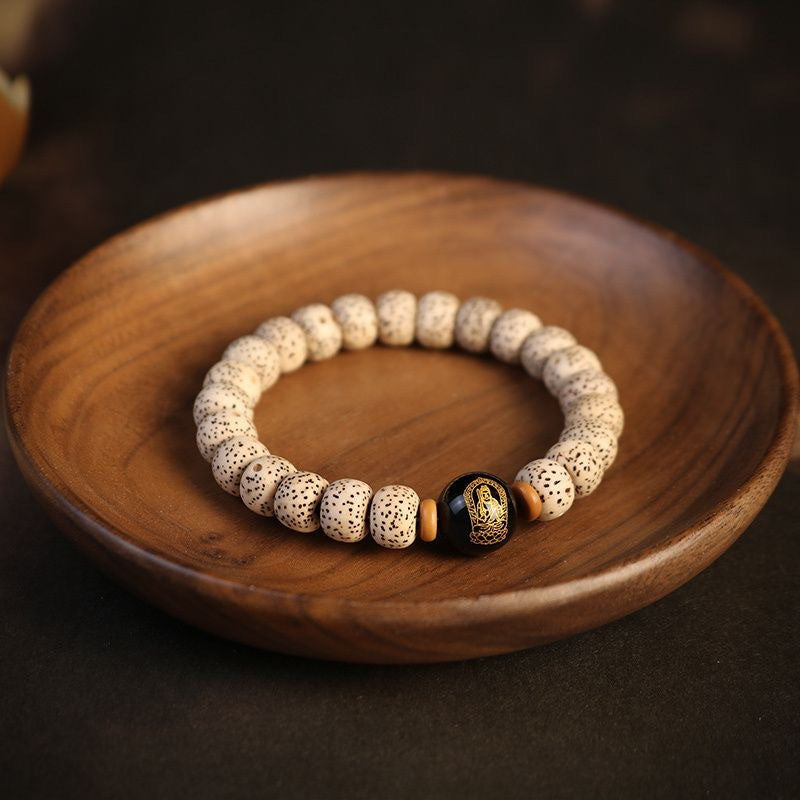 Detailed shot of Bodhi beads bracelet, highlighting its handcrafted quality