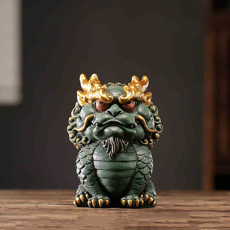 Front view of a hand-carved Chinese dragon statue made from Qing Sha Stone, showcasing its intricate details.