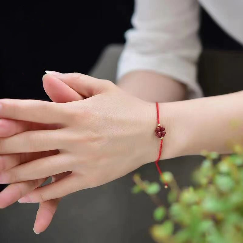 Cinnabar Four Leaf Clover Bracelet worn on wrist