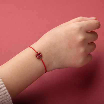 Natural Cinnabar Four Leaf Clover Red String Bracelet worn on wrist