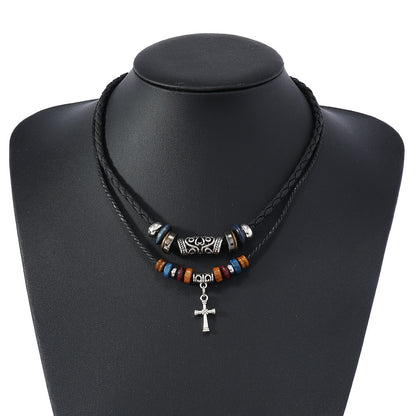 Model wearing Double Cross Wood Bead Necklace with alloy cross pendant and wooden beads. 