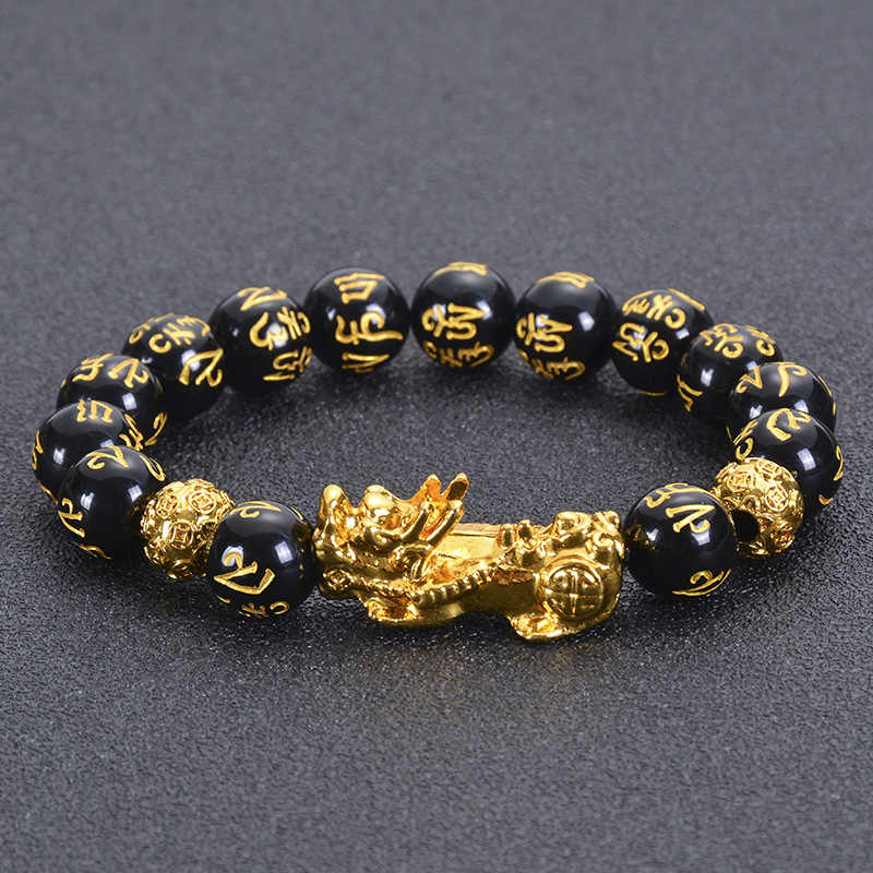 Detailed view of Feng Shui Obsidian Bracelet with gold Pi Xiu and engraved mantra for wealth and protection