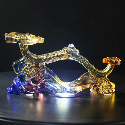 Full view of glass Ruyi ornament, symbolizing good luck and prosperity