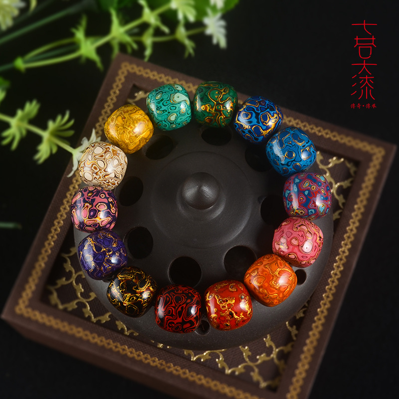 Close-up view of handcrafted lacquer bead bracelet showcasing detailed craftsmanship