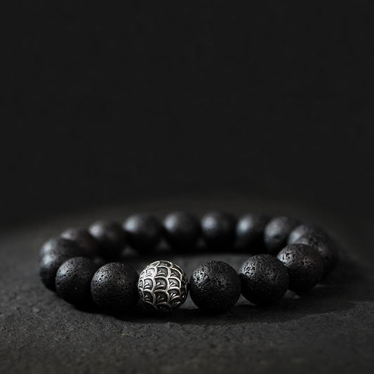 Lava Stone Bracelet displayed with a natural background, showcasing the rugged texture and grounding energy of the lava stones