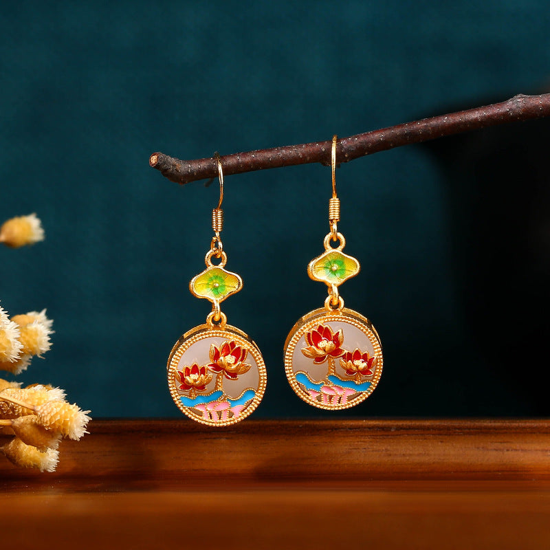 Lotus Tassel Earrings shown against a stylish background, emphasizing the elegance and spiritual symbolism of the earrings