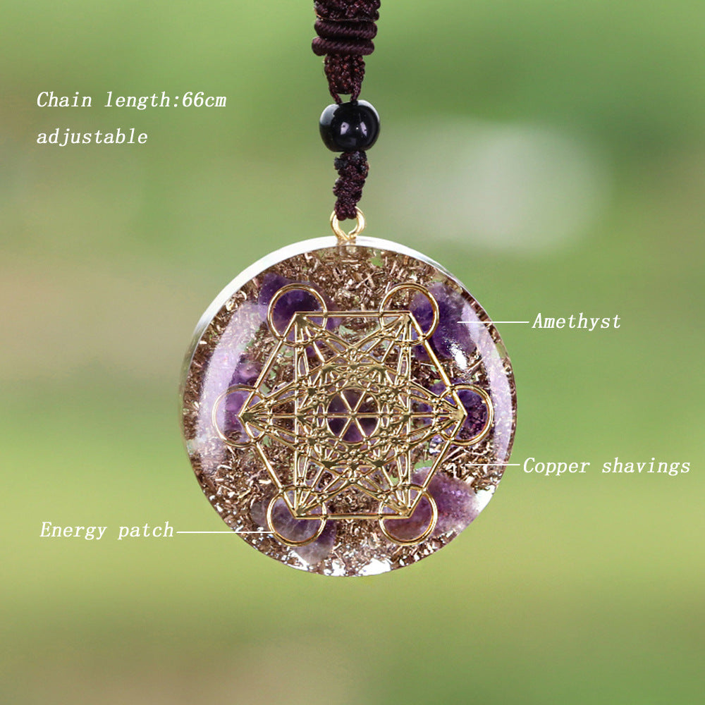 Close-up of natural amethyst crystal in the Metatron's Cube Pendant, showcasing its texture