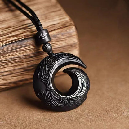 Obsidian pendant manifesting necklace with Chinese symbol of good fortune, showcasing its intricate design