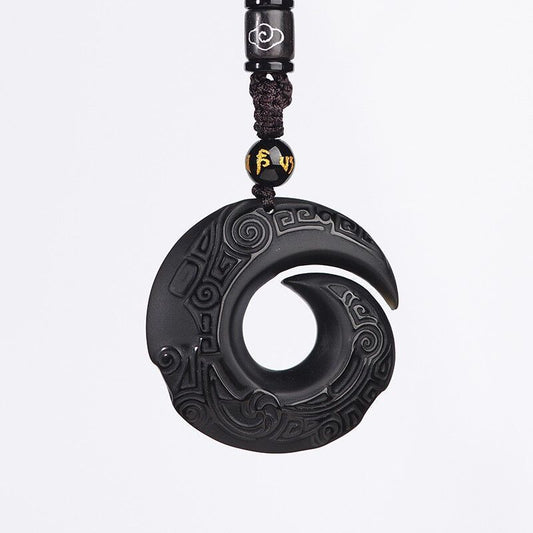 Obsidian pendant manifesting necklace on white background, featuring the symbol of good fortune