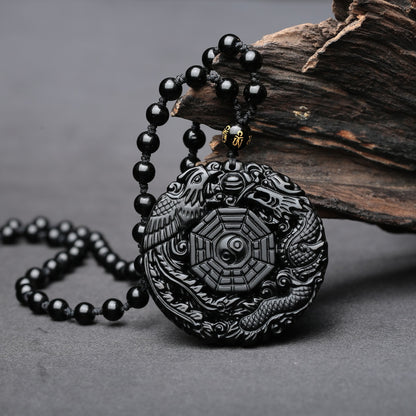 Obsidian pendant necklace with dragon, phoenix, and Taiji Bagua symbol 