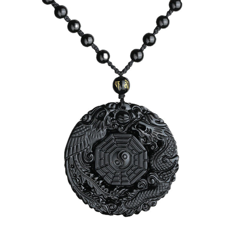 Obsidian pendant necklace with dragon and phoenix design displayed on white background