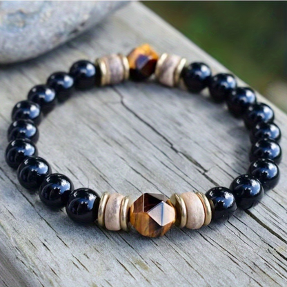 Close-up of the black obsidian beads on the Obsidian Bead Bracelet with Tiger Eye