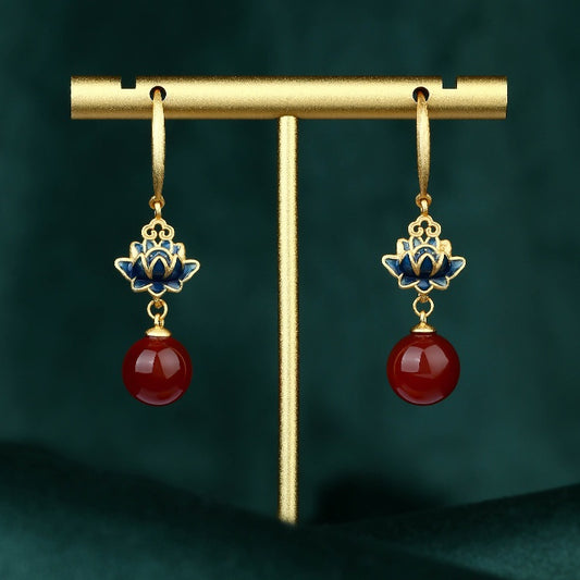 Front view of the elegant pearl lotus flower earrings, featuring a jade accent and symbolic lotus design