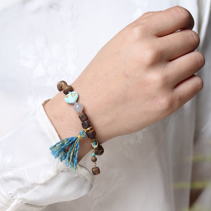 The Qinan Agarwood  Bracelet worn on the wrist, highlighting its elegance