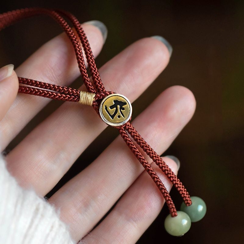 Another view of hand wearing Red String Protection Bracelet, showcasing its design