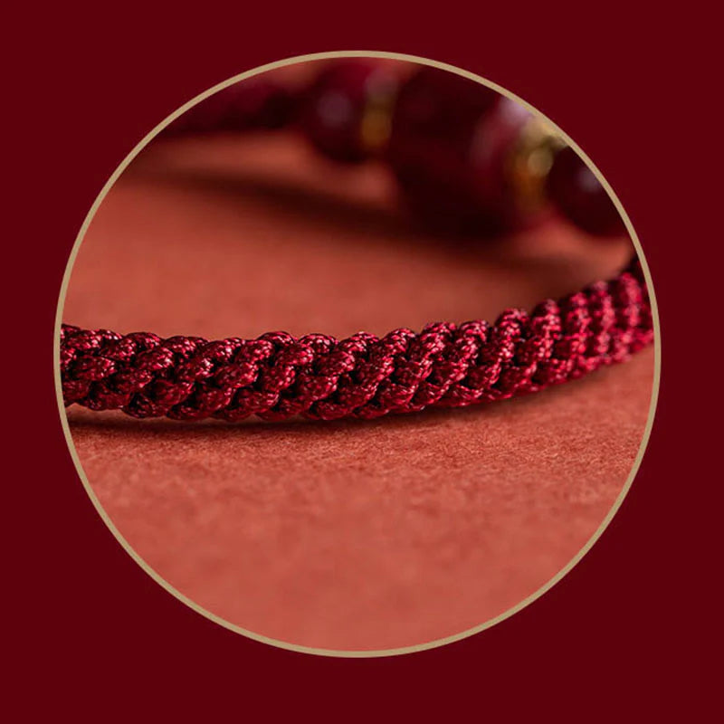 Close-up of Tibetan Red String, showcasing its quality and craftsmanship in the bracelet