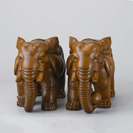 Front view of the handcrafted resin elephant sculpture, showcasing the intricate details and craftsmanship