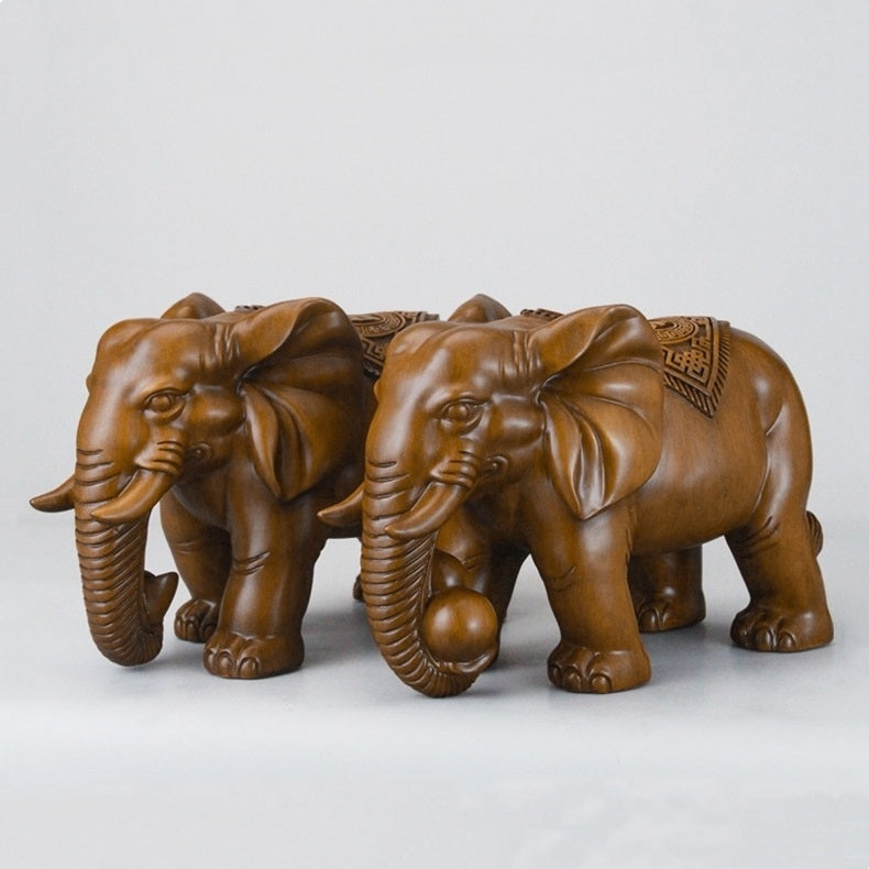 Side view of the resin elephant sculpture, highlighting the elegant curves and realistic design