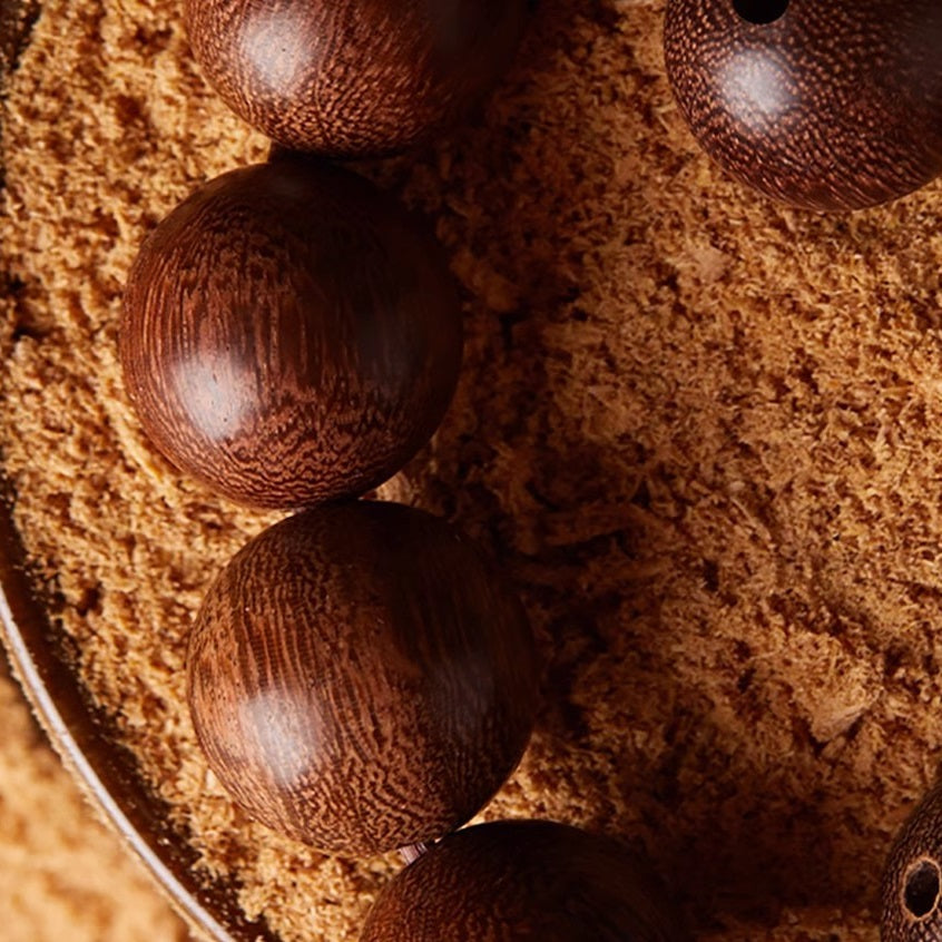 Close-up of Sandalwood Beads and Hetian Jade on Buddhist Mala Bracelet