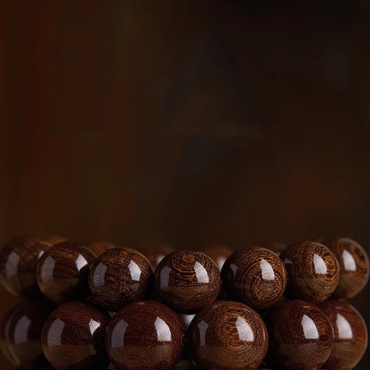 Close-up of Sandalwood & Hetian Jade Buddhist Mala Bracelet, Detailing Wooden Beads and Jade