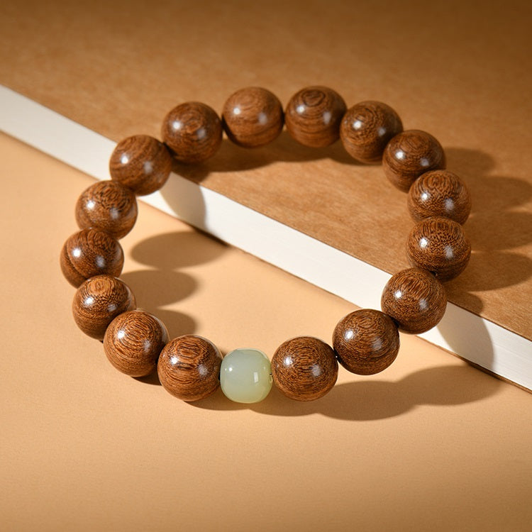 Sandalwood & Hetian Jade Buddhist Mala Bracelet on display, Showing Wooden Beads and Jade Charm