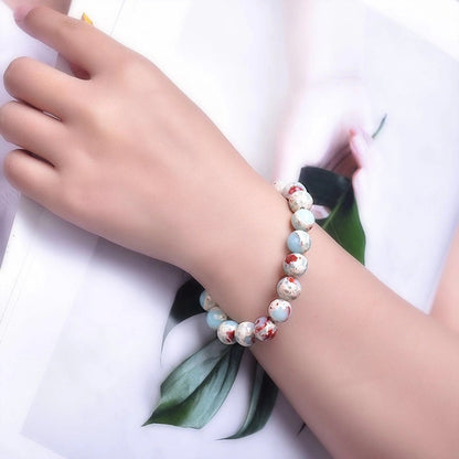 Shoushan Stone Lotus Bracelet worn on wrist, demonstrating its calming and protective benefits