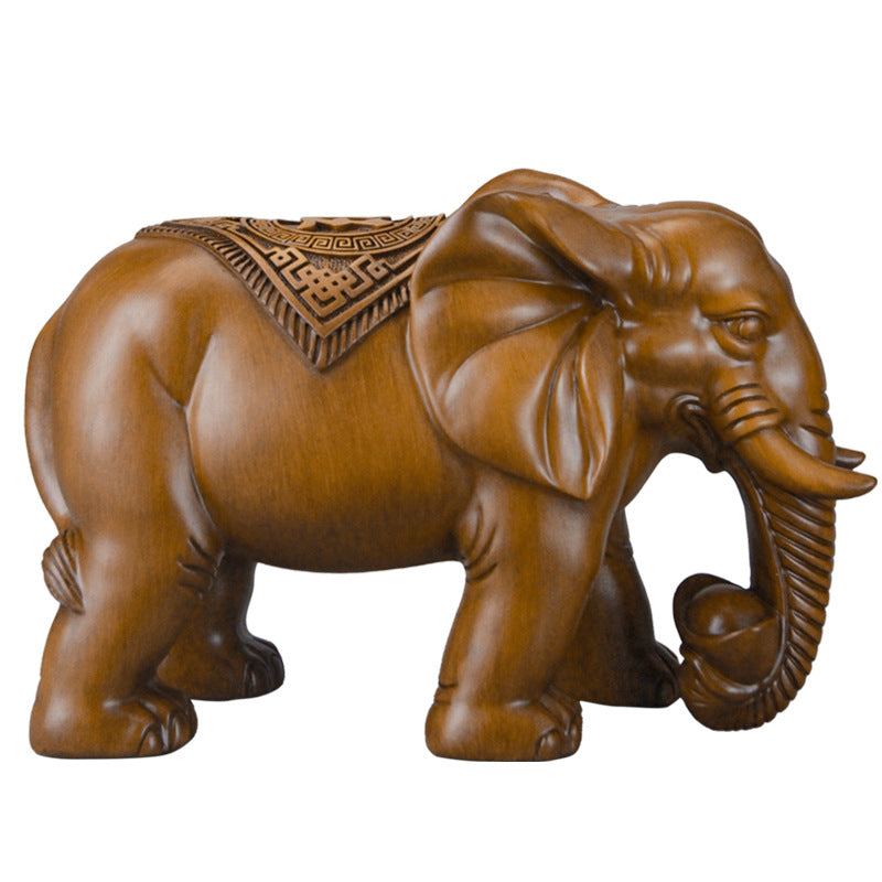 Single resin elephant figurine on a white background, showcasing the unique design and detailed features of the sculpture