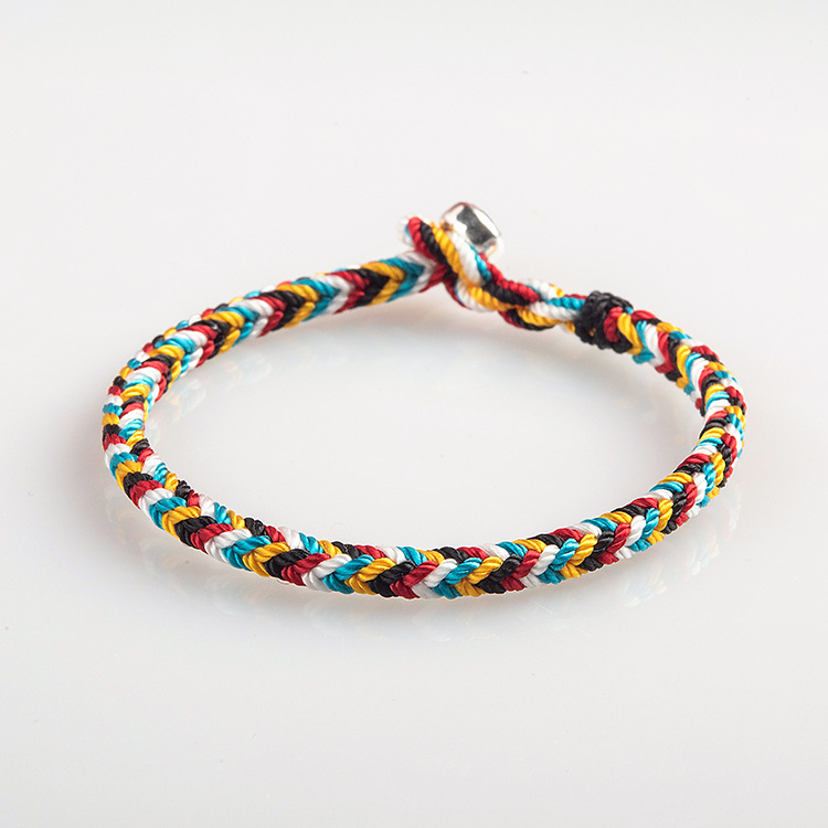 Tibet Handmade Protection Braid Bracelet on white background, highlighting intricate braiding and protection symbol