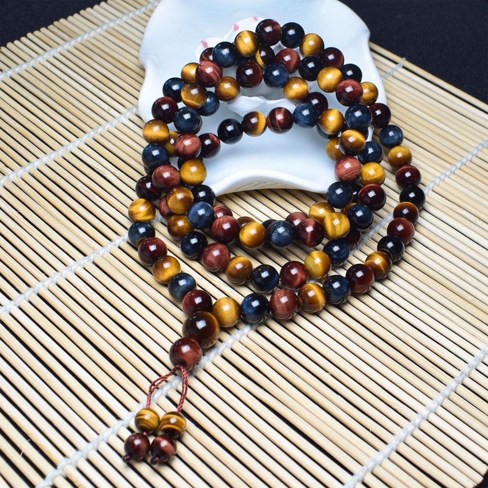 Tibetan Tiger's Eye Mala Bracelet worn in a lifestyle setting, offering protection and spiritual peace