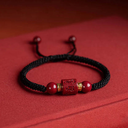 Tibetan Cinnabar Bracelet with black string, engraved with Six True Words for protection and fortune