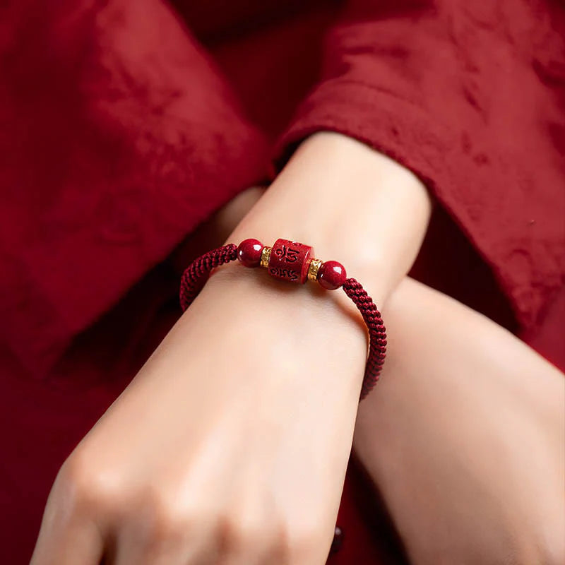 Tibetan Cinnabar Red String Bracelet worn on wrist, offering spiritual protection and luck