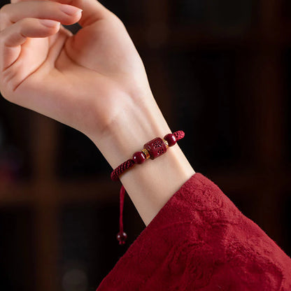 Close-up of Tibetan Cinnabar Bracelet worn on wrist, featuring Six True Words for spiritual blessing