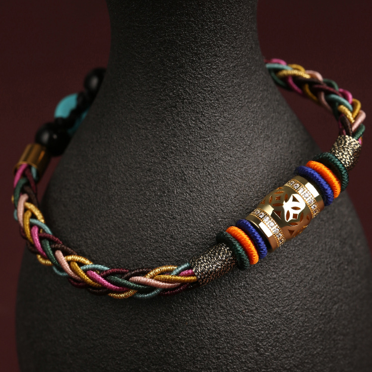 Tibetan King Kong Knot Luck Weave String Bracelet placed on a bottle for display