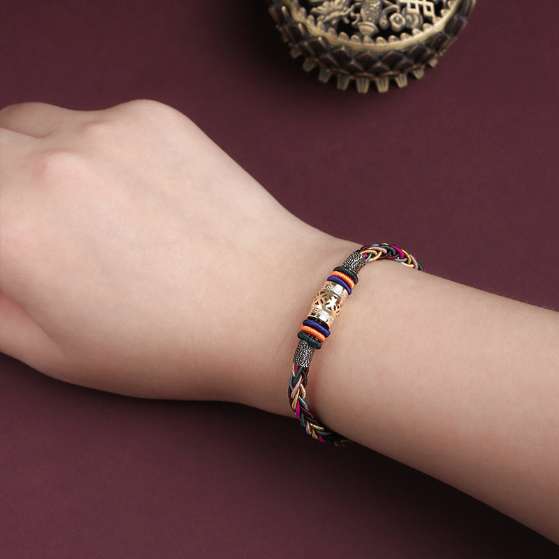 Hand wearing the Tibetan bracelet, offering protection and positive energy