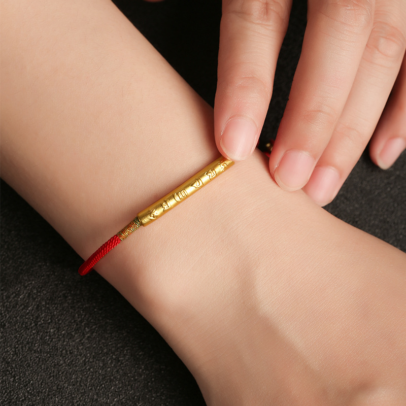 Tibetan Lucky Charm Red String Bracelet worn with gold charm