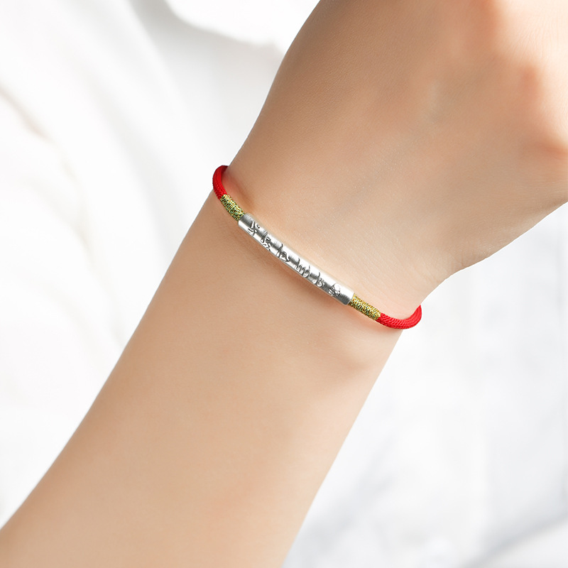 Tibetan Lucky Charm Red String Bracelet worn with silver charm