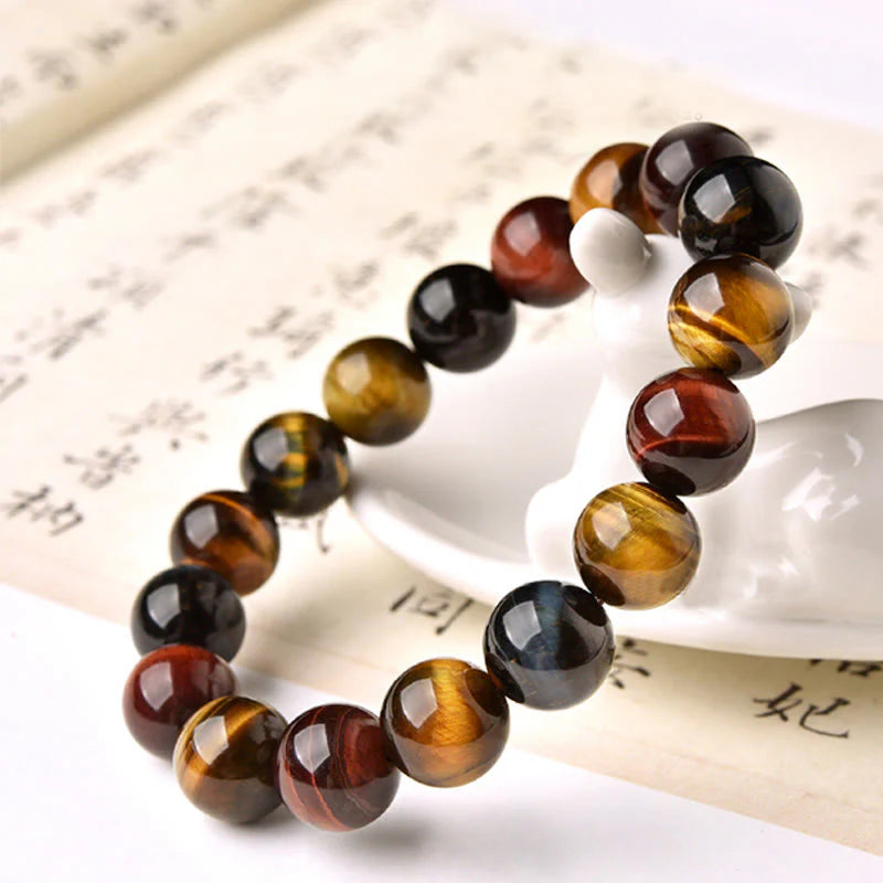 Side view of the Natural Tiger Eye Positive Protection Bracelet with blue, red, and yellow tiger eye stones