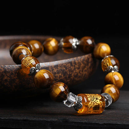 Tiger's Eye bracelet displayed on a black background highlighting the rich color of the stone