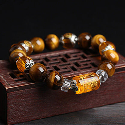 Tiger's Eye bracelet with Three-Faced God crystal, showing the bracelet's full length