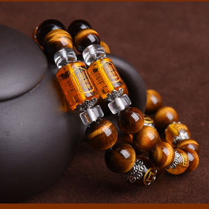 Close-up of the Tiger's Eye bracelet with Three-Faced God crystal