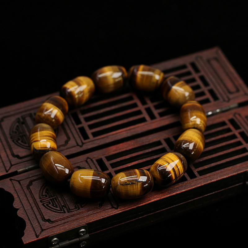 Side view of the Natural Tiger's Eye Wisdom Bracelet with barrel-shaped beads, showcasing the design