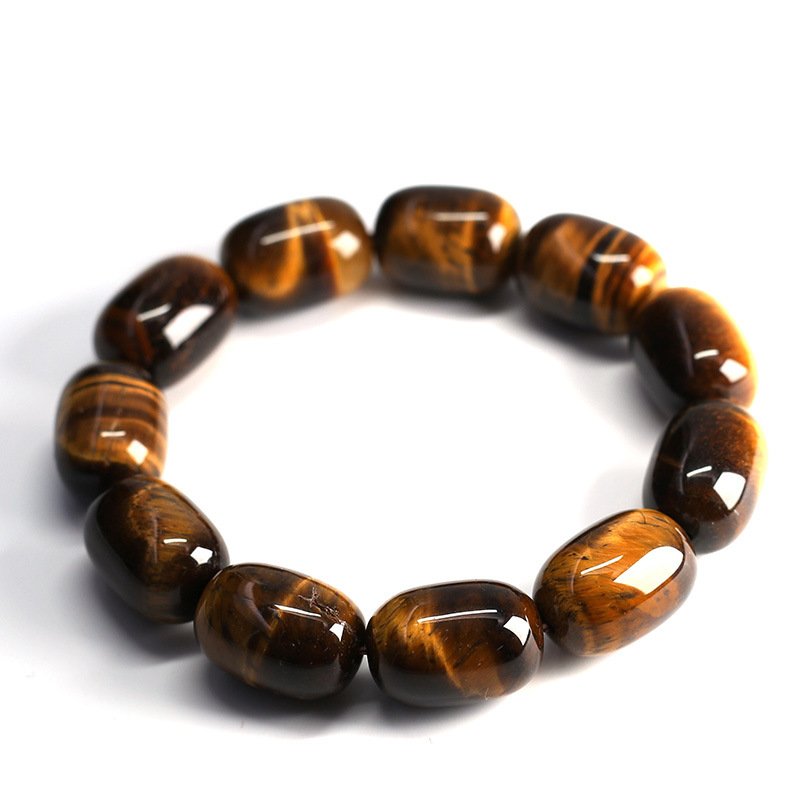 Angle view of Natural Tiger's Eye Wisdom Bracelet with barrel beads on white background