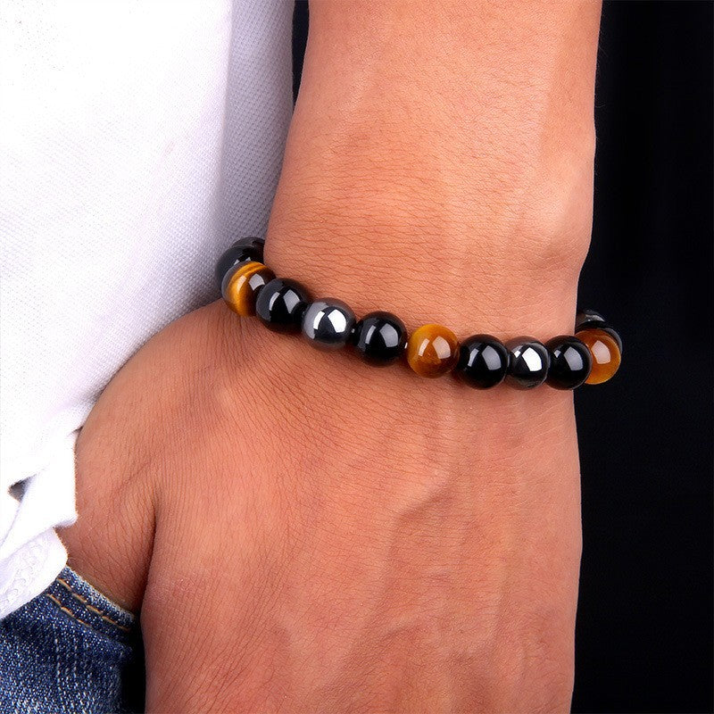 Wearing the Triple Protection Energy Bracelet with Tiger Eye, Obsidian, and Hematit