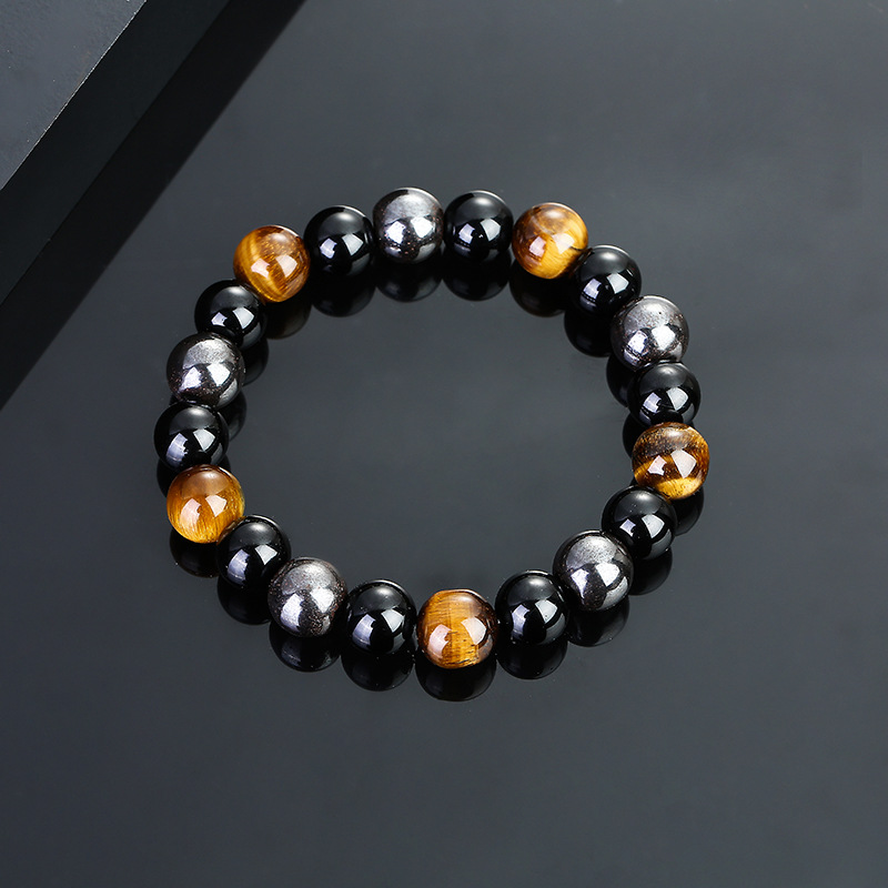 Energy bracelet featuring Tiger Eye, Obsidian, and Hematite stones